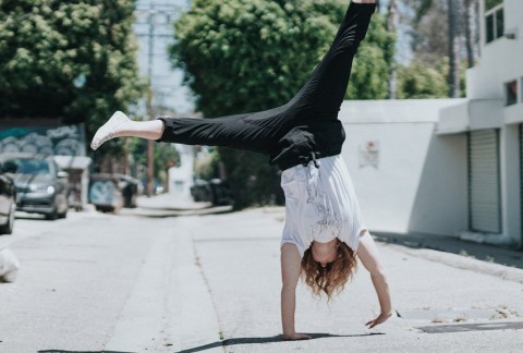 Person doing a cartwheel on the street